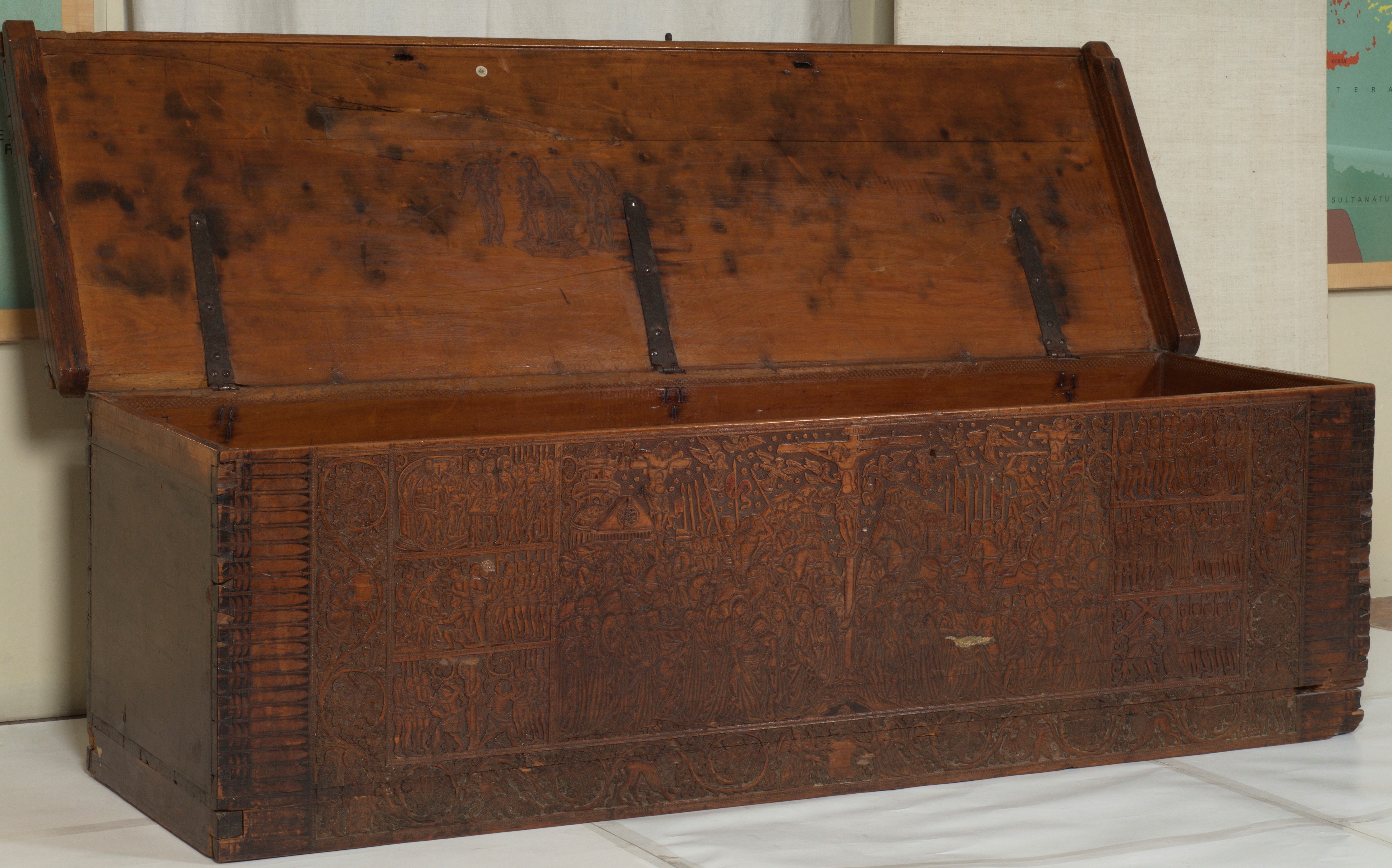 <p>Wooden Sacristy Chest with a central scene of the Crucifixion and framing scenes from the Passion Cycle, ca. 1450, carved, stamped, and punched cypress with ink drawing, likely of Italian origin, Collection of Putna Monastery, Romania (source: Putna Monastery)</p>