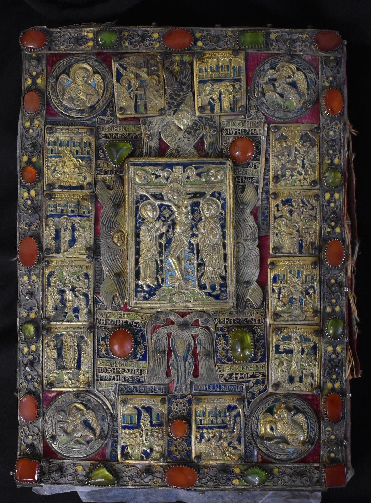 <p>Front cover of Gospel book by the goldsmith Dimos, 1673, front cover; wooden board, velvet, metallic plaques and stripes, partly gilt, enamel, repoussé, filigree, Church of St Nicholas, Metaxochori, Aghia, Thessaly) (source: project «Ecclesiastical Silver: Study and Documentation using Non-Destructive Techniques of Ecclesiastic Plate in Magnesia and Larissa Districts (15th - 19th centuries)» (MIS 5005968), Y. Varalis and C. Dolmas)</p>